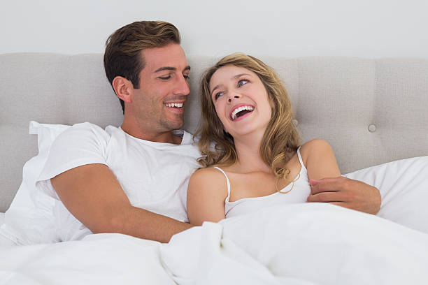 istock Cheerful relaxed couple sitting in bed 466524198