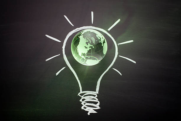 istock Glass Globe on Blackboard - Renewable Energy Environmental Conservation 466524579