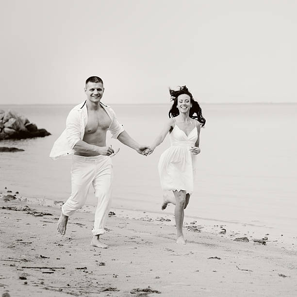 istock Young happy couple at seaside. 466527794
