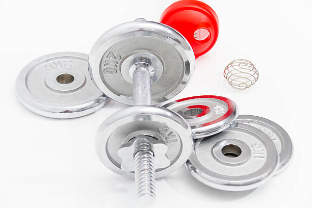 istock Black dumbbells and loose weights 466527992