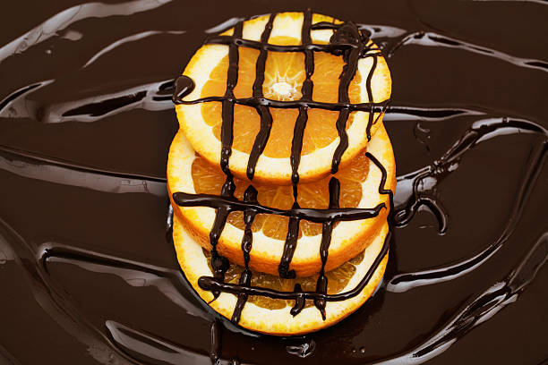 Molten chocolate over oranges