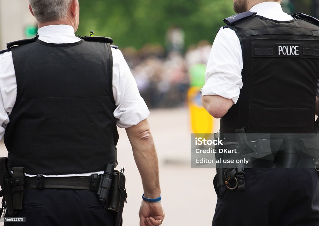 Two British Policemen London, United Kingdom- May 5, 2014: Two policemen near Buckingham Palace during the changing of the guard royal guards Police Force Stock Photo