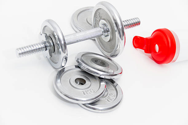 istock Black dumbbells and loose weights 466536214