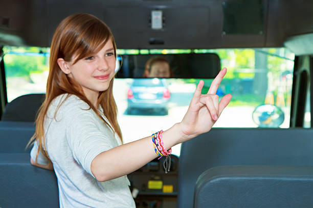 Teen Using Sign Language On The School Bus