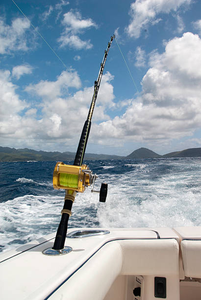 Deep Sea Fishing Rod On Boat In Hawaii Stock Photo - Download