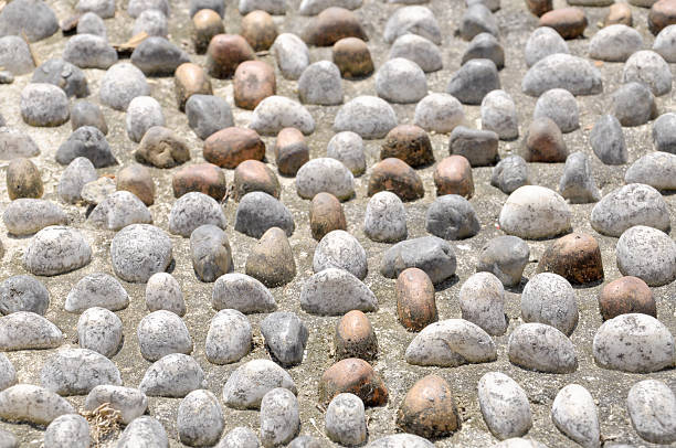 istock Pebble Stone On Pavement For Foot Reflexology Pathway 466542468