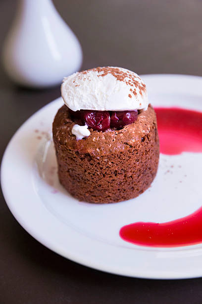 istock Dessert with chocolate sponge cake, cherry and vanilla ice cream 466545254