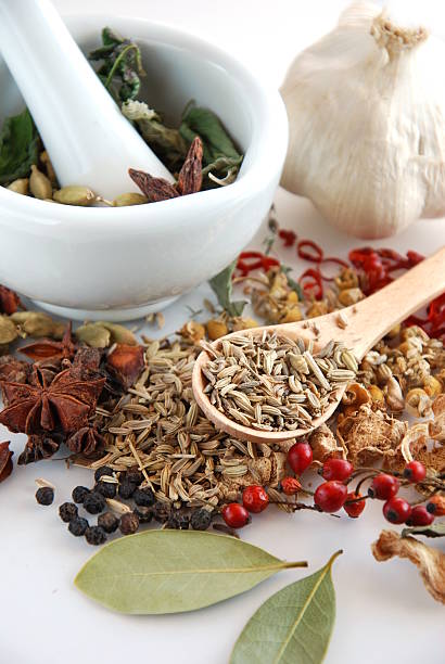istock dried spices and herbs with mortar 466545784