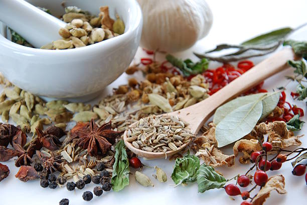 istock dried spices and herbs with mortar 466545790