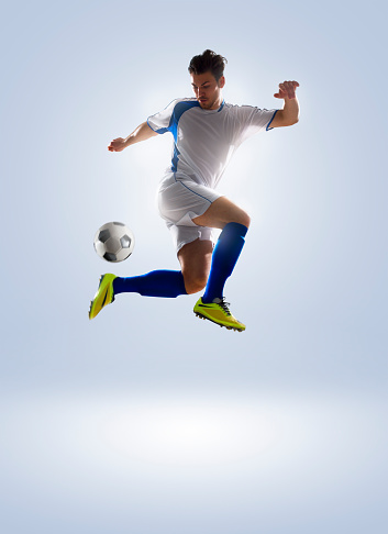 football soccer player in action  isolated on color background