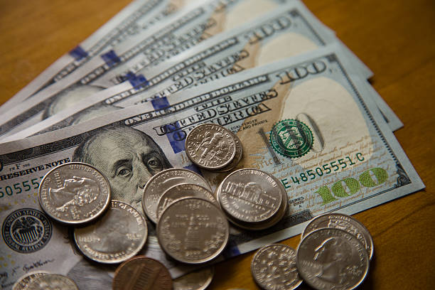 istock coins and banknotes of dollars. 466549640
