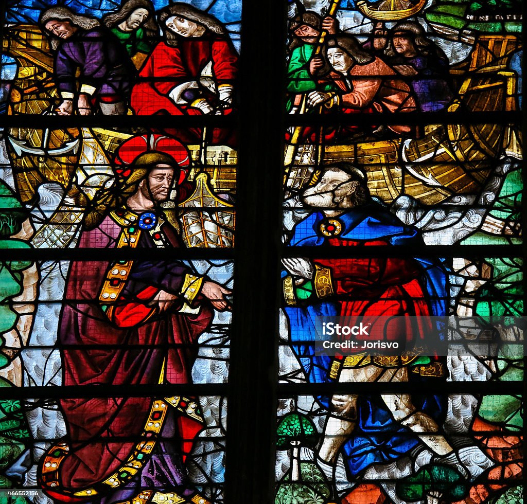 Saint Peter is called by Jesus - Stained Glass Medieval Stained glass window depicting Jesus calling Simon Petrus (Saint Peter) to become a "fisher of men"  in the Cathedral of Rouen, France. Fisher - Role Stock Photo