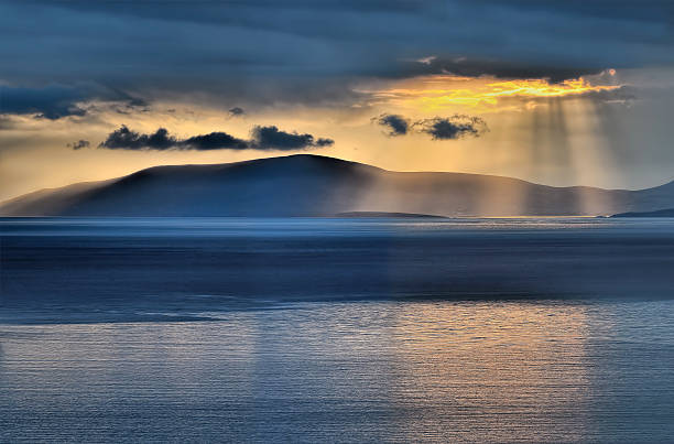 Sunset at Dingle bay. Sunset at Dingle bay. Dramatic sky after a thunderstorm. dingle bay stock pictures, royalty-free photos & images