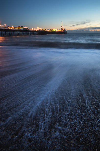 istock Beautiful long exposure landscape of waves receding with pier 466555921