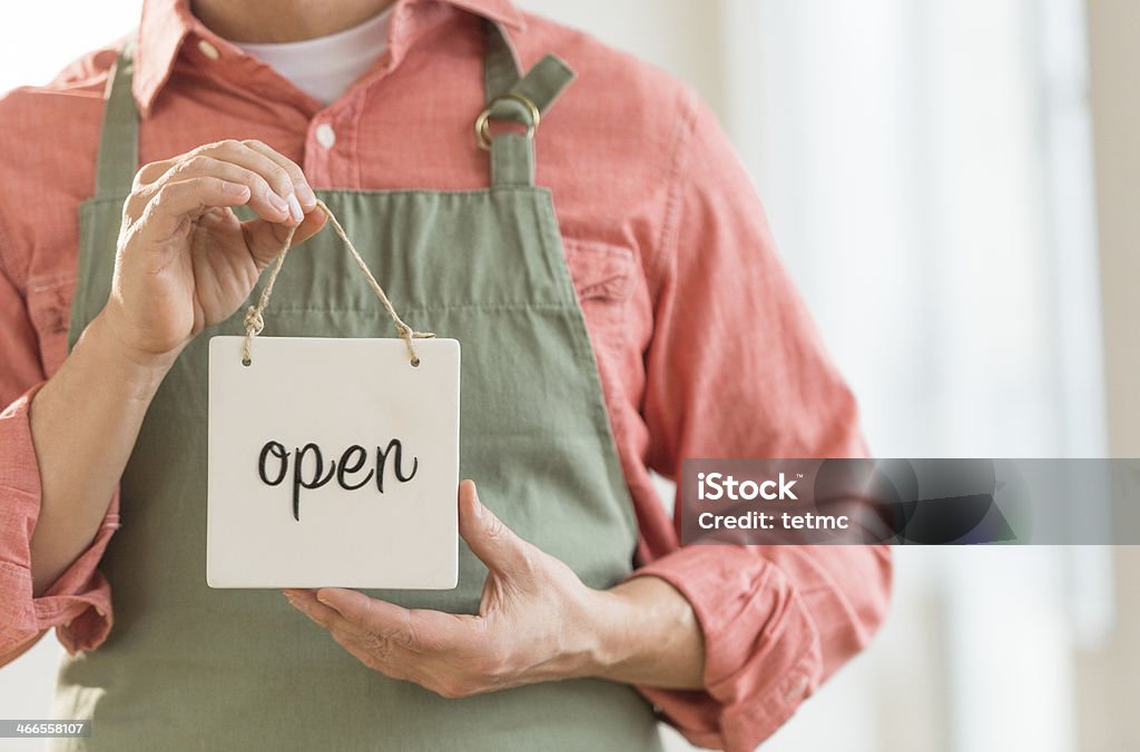 Man Showing Open Sign Midsection of mature man showing open sign 50-59 Years Stock Photo