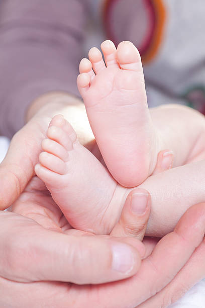 istock Hold new-borns feet 466559187
