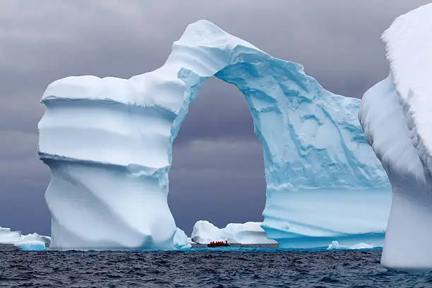Photo of Spectacular Arch Shaped Iceberg in Antarctica