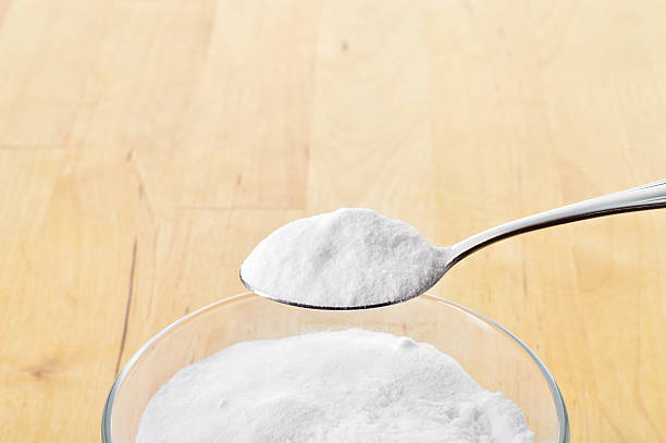 istock Close-up of baking soda being scooped up with spoon 466566675
