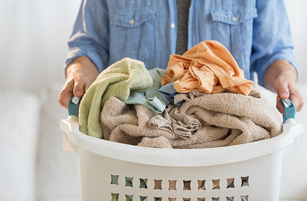 istock Man Holding Laundry Basket At Home 466567183
