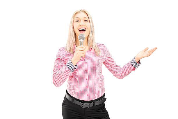 istock Young female singing on a microphone 466567545
