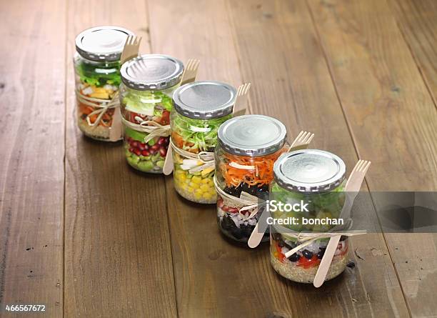 Five Jars Of Salad Tied With String With A Fork Attached Stock Photo - Download Image Now