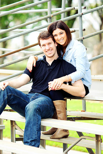 istock Couple sitting on bleachers 466572705