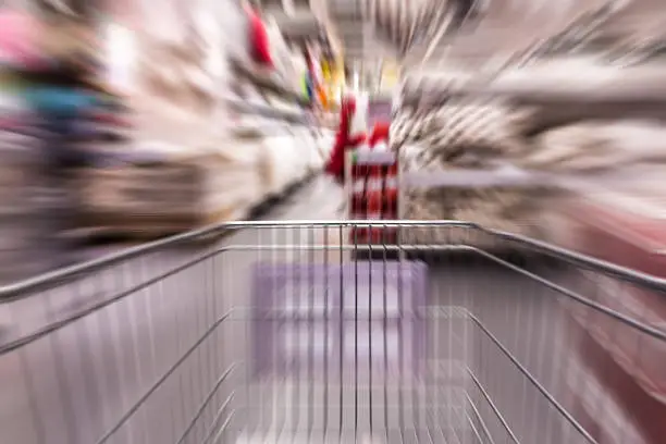 Motion blurred  shopping cart in home furniture store
