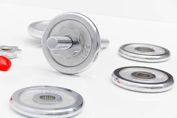 istock Black dumbbells and loose weights 466575928