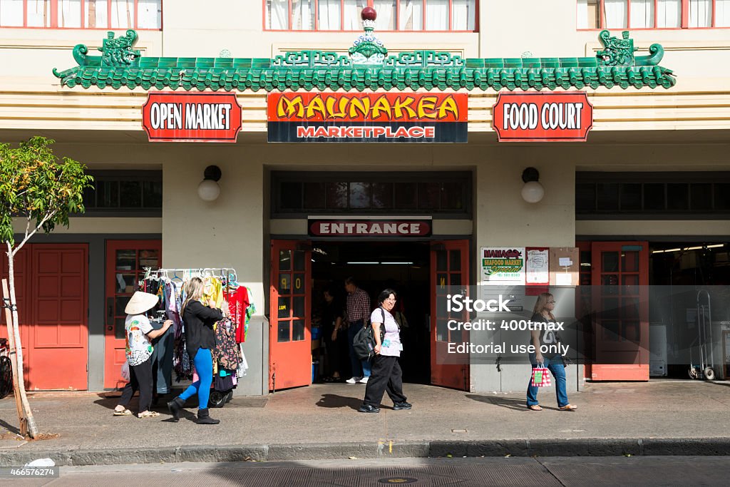 Maunakea Marketplace Honolulu, USA - December 18, 2014: People passing Maunakea Marketplace Entrance in Oahu's famous Chinatown district late in the day.  2015 Stock Photo
