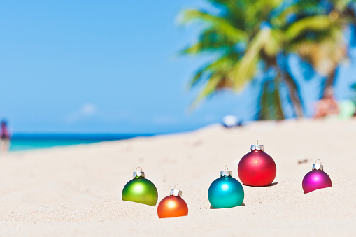 Christmas concept: Christmas baubles hanging on a tropical beach in Las Terrenas, Dominican Republic. 