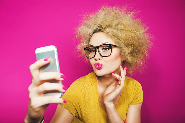 istock Woman in glasses taking a selfie 466583853