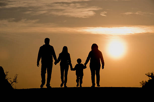 istock Silhouette of a family venturing outdoors at dusk 466587553