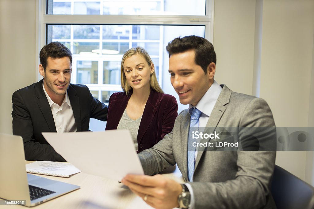 Couple meeting real-estate agent to buy property Woman man banker contract office home architect Adult Stock Photo