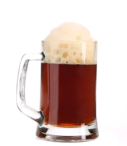 istock Tall big mug of brown beer with foam. 466588105