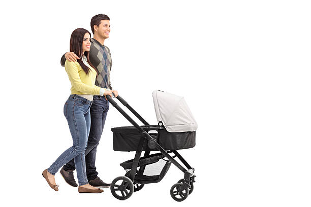 istock Young parents pushing a baby stroller 466588754