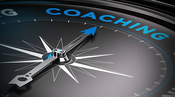 Coaching Attain personal goals, personal trainer concept. Conceptual Compass with needle pointing to the word coaching. showing stock pictures, royalty-free photos & images