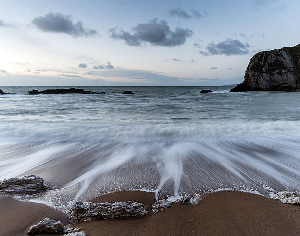 istock Beach sunrise landscape with long exposure waves movement 466592957