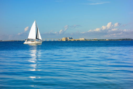 Sailboat passing by Fort Myers and Sanibel Island, Florida, USA