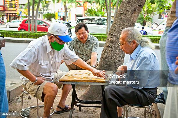 Men Playing Traditional Board Game In Saigon Vietnam Stock Photo - Download Image Now