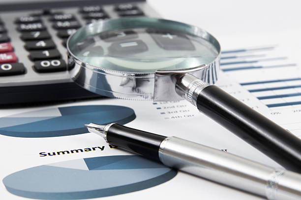 istock magnifying glass on the business report 466601039