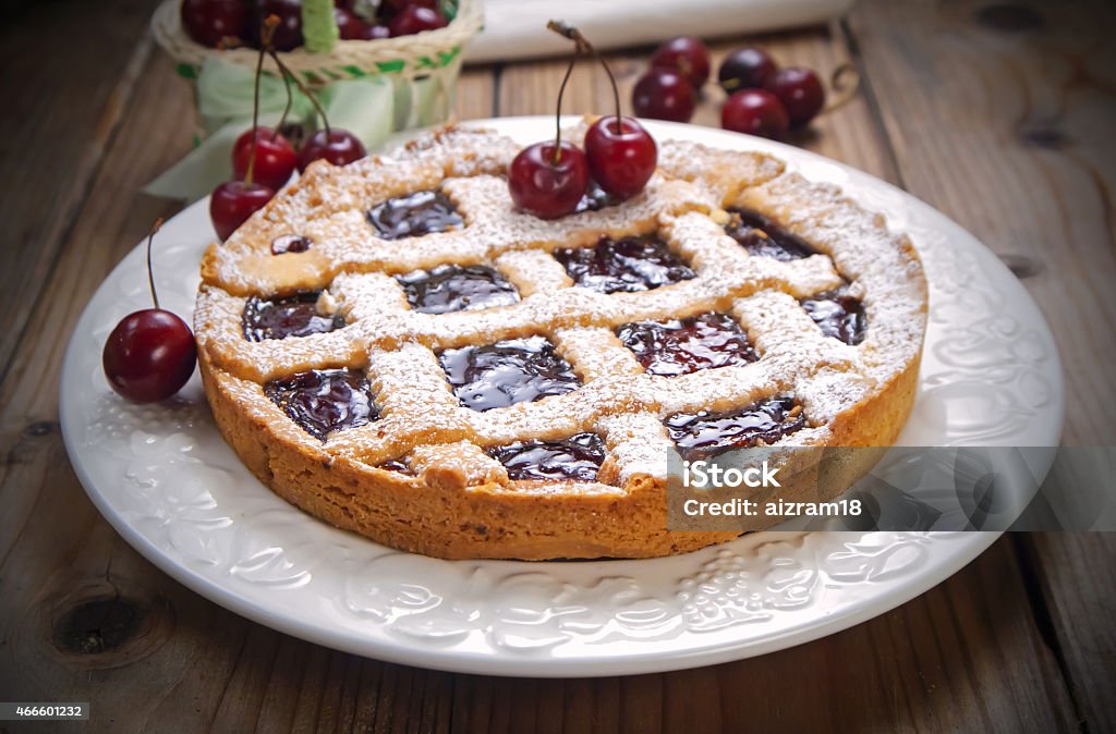 Cherry crostata pie Cherry crostata pie on white plate Crostata Stock Photo