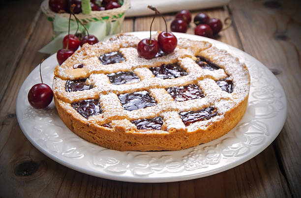 Cherry crostata pie Cherry crostata pie on white plate crostata stock pictures, royalty-free photos & images