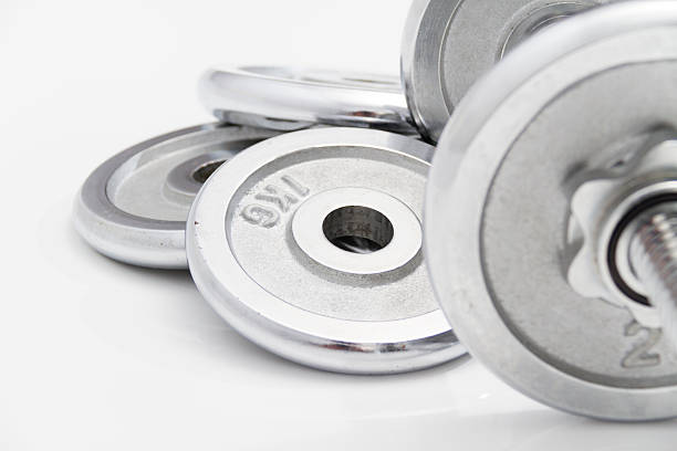 istock Black dumbbells and loose weights 466601424