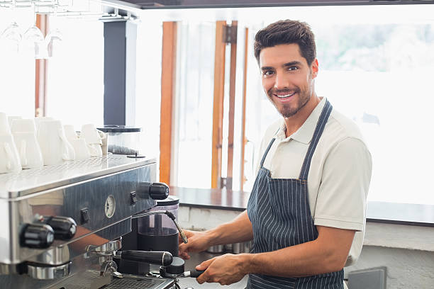 istock Smiling barista preparing espresso at coffee shop 466601710
