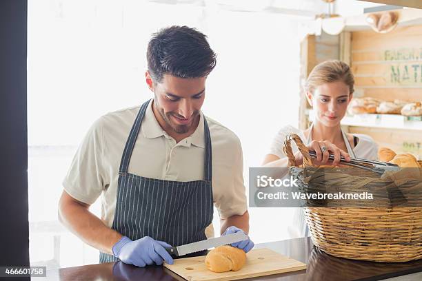 Young Waiter With Croissant At The Coffee Shop Counter Stock Photo - Download Image Now