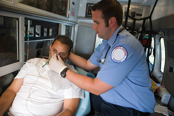 istock Paramedic tending victim in ambulance 466602492