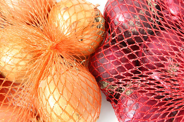 istock Image of red and white onions, sold in string net-bags 466602562
