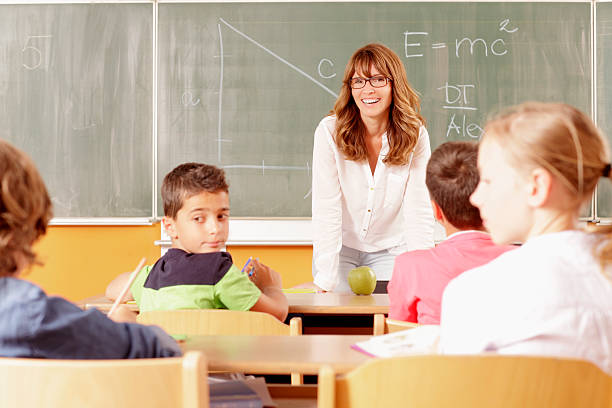 istock Teacher portrait in the classroom 466603989