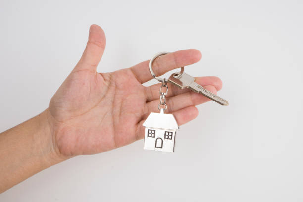 istock Close-up of hand holding house Key ring 466605915