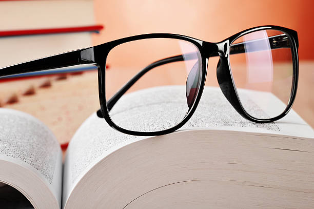 istock Composition with glasses and books on the table 466606255